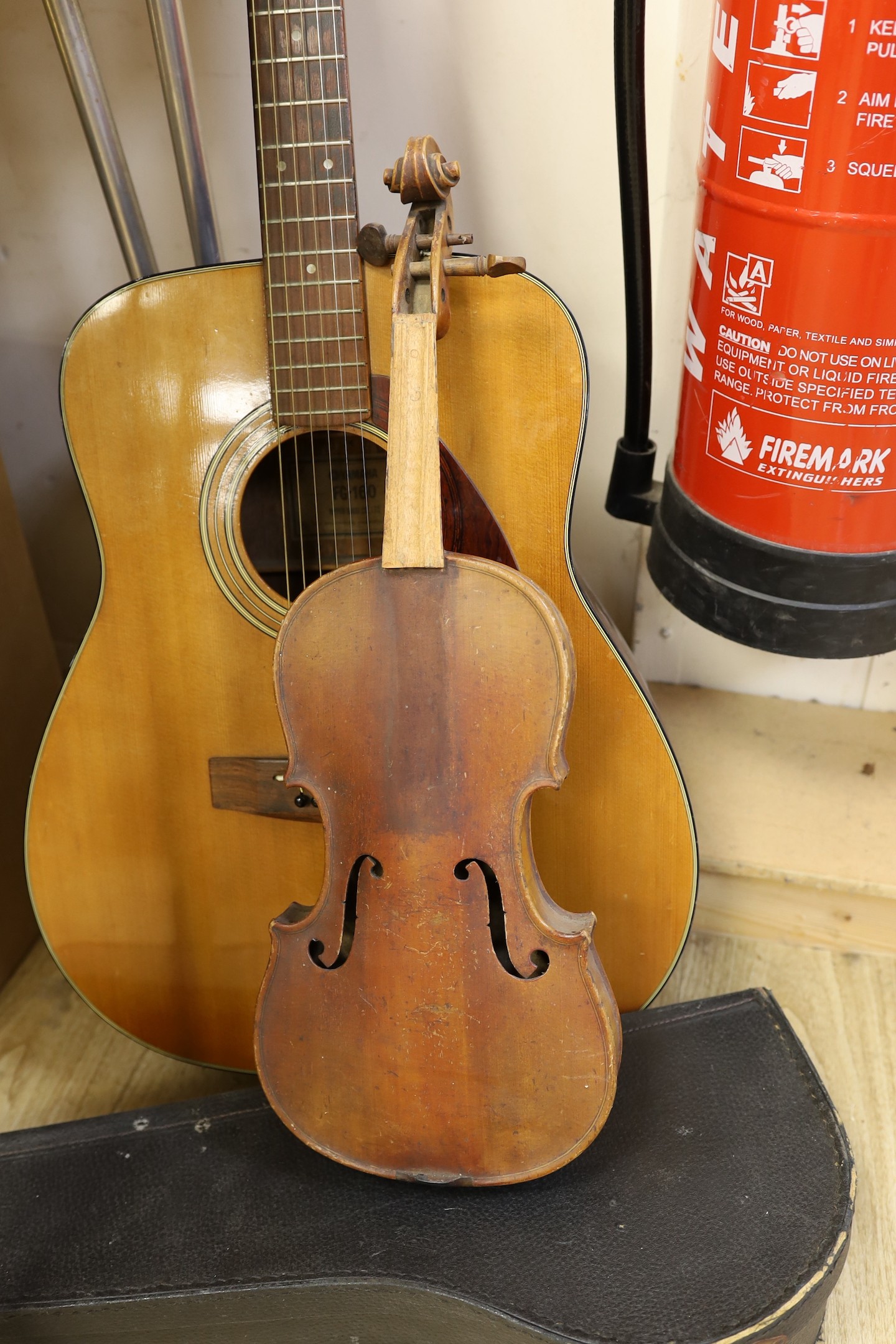 A Yamaha G160 acoustic guitar, dreadnought shape, a 3/4 size violin and a ukulele banjo